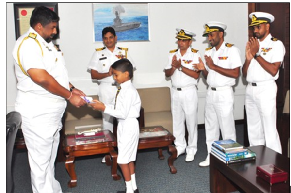 Writer as the Chief of Defence Staff with the Son of Chief Petty Officer K G Shantha in 2018